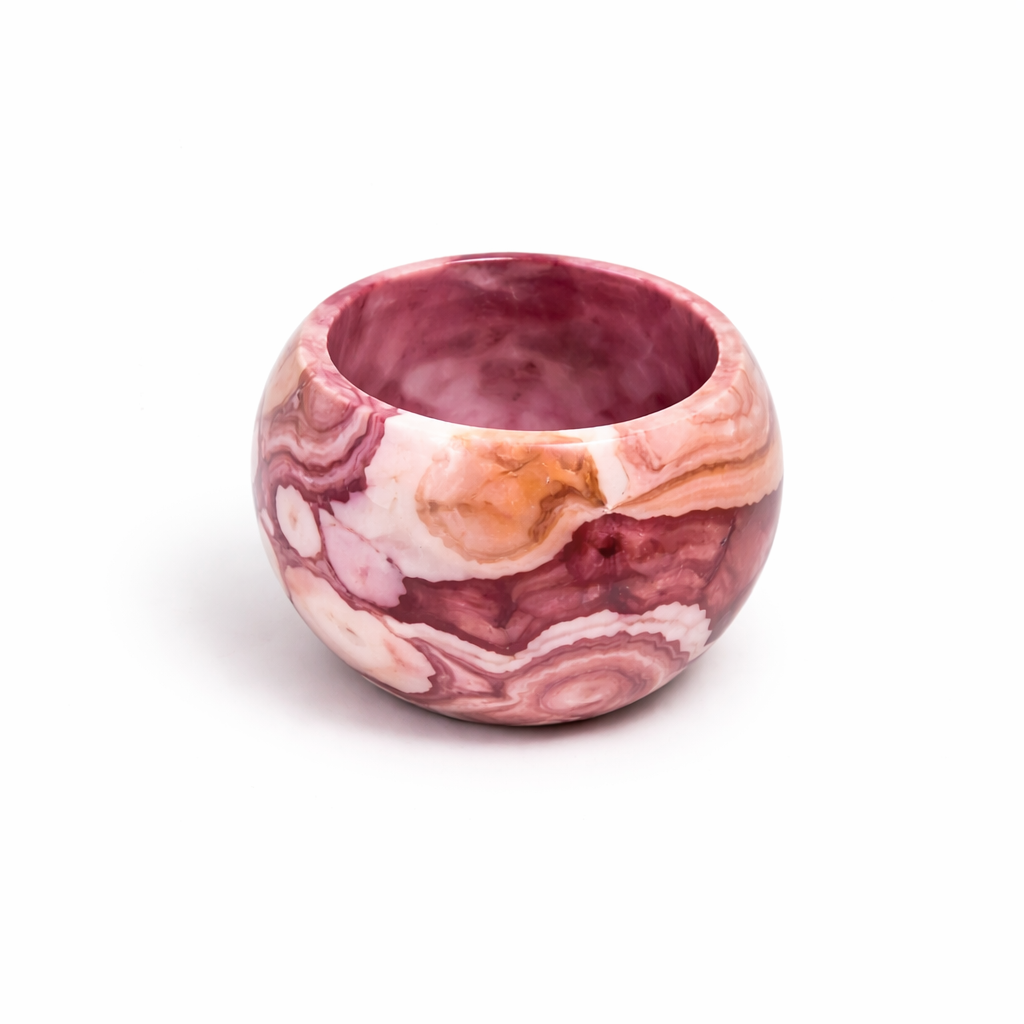 Pink marble textured round planter for small indoor plants.