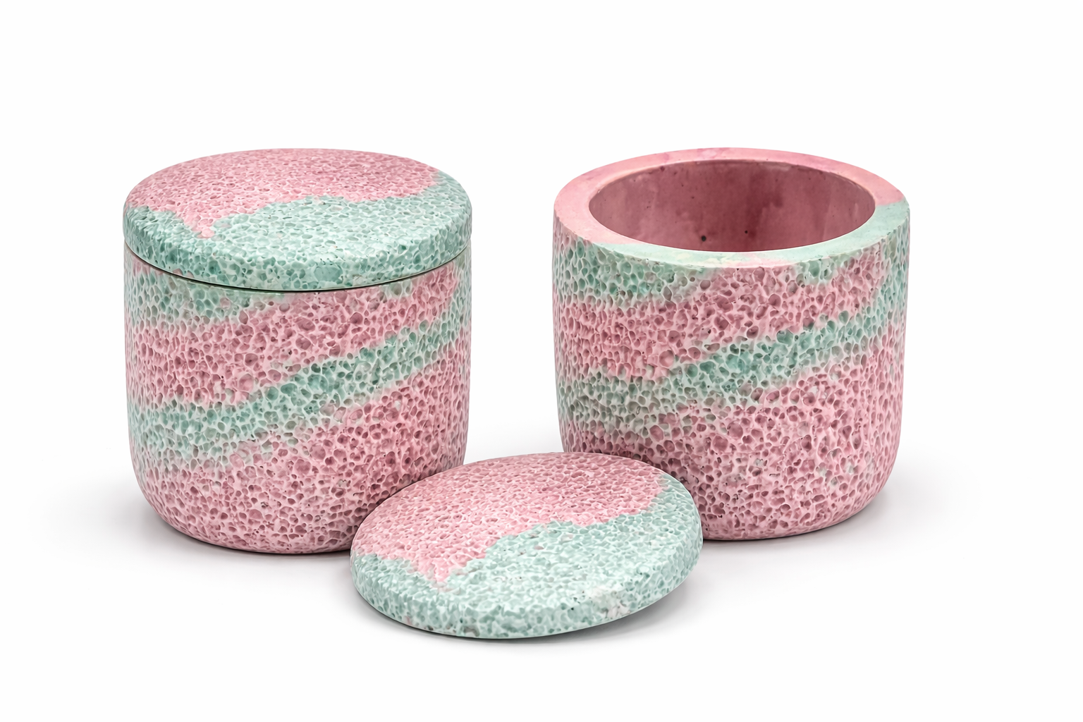 Set of three ceramic jars with pink and Blue striped pattern on a white background