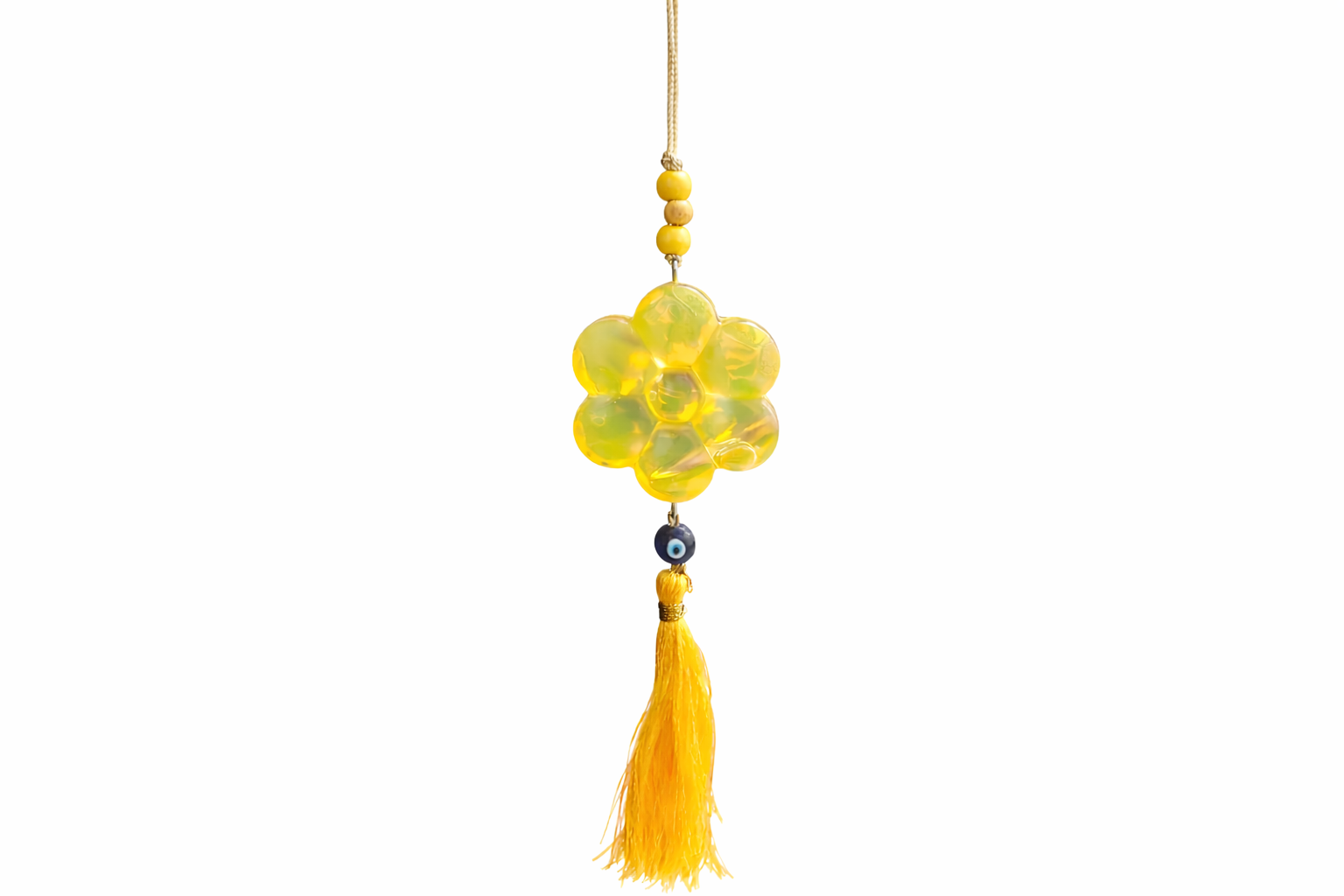 Yellow decorative hanging ornament with beads and tassel on a white background