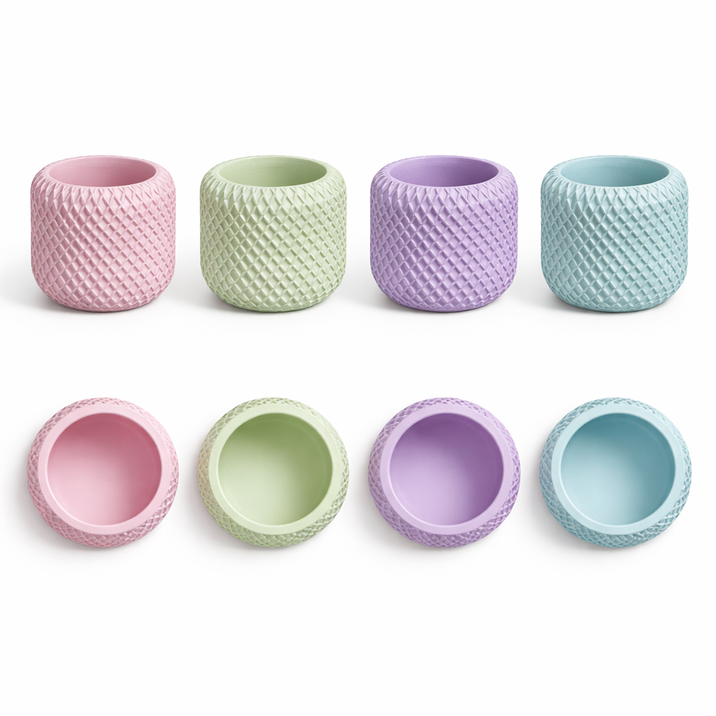 Set of eight pastel-colored textured cups on a white background